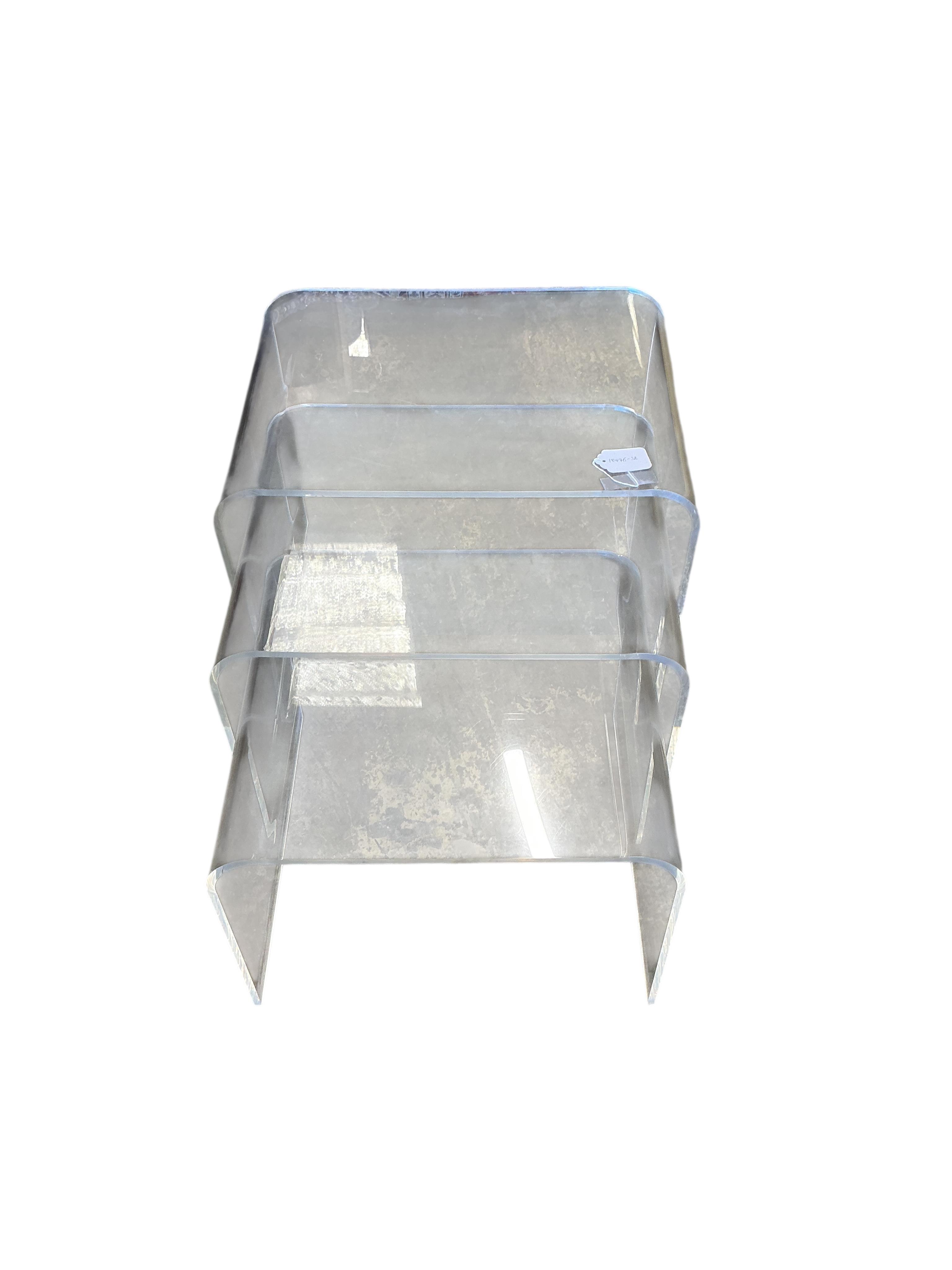 A nest of three Contemporary Perspex tea tables, width 50cm, depth 37cm, height 40cm